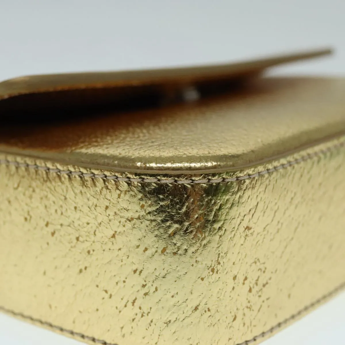 Prada -- Gold Leather Accessories