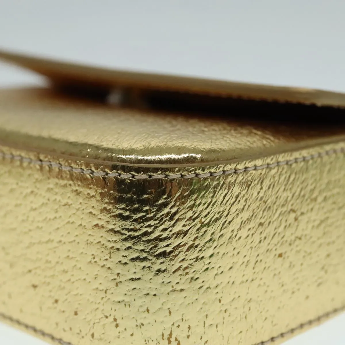 Prada -- Gold Leather Accessories