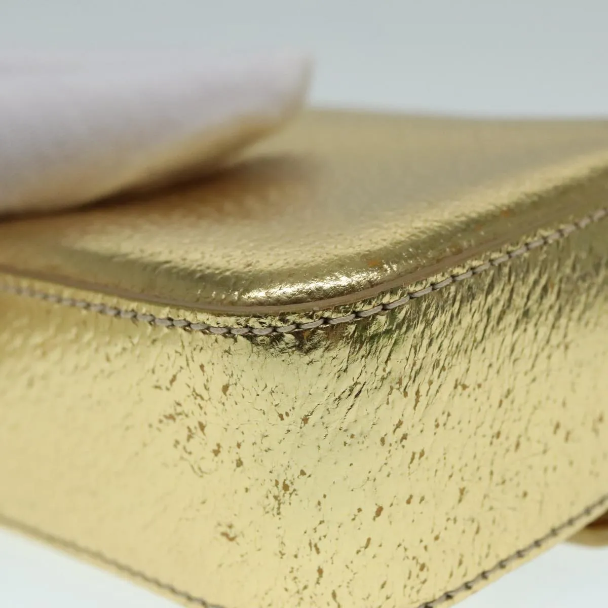 Prada -- Gold Leather Accessories